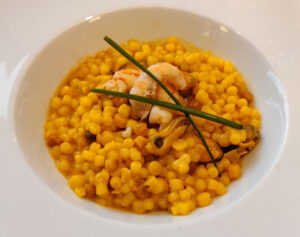 Fregola mit Ragout des Meeres