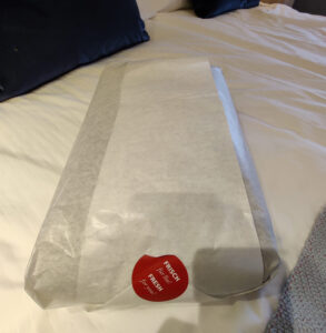 Bademantel verpackt